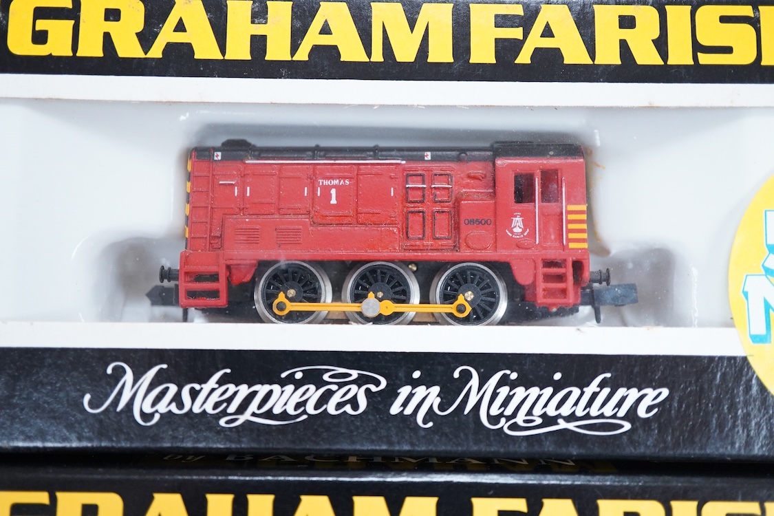 Four boxed Graham Farish N gauge railway Class 08 0-6-0 diesel locomotives; a BR, D4019 (1005), a Railfreight Distribution, 08 653 (371-000), an EWS, 08933 (371-002) and a Thomas 1, 08500 (1006).
